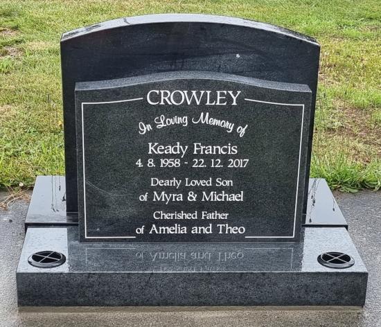 Classic upright headstone with a low saddle top crafted from granite by Stoneworx - Memorials of Distinction in New Zealand.