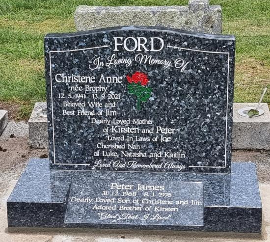 Classic upright headstone with a low saddle top crafted from granite by Stoneworx - Memorials of Distinction in New Zealand.