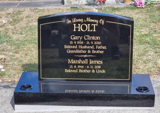 Classic upright headstone with camber top crafted from granite by Stoneworx - Memorials of Distinction in New Zealand.