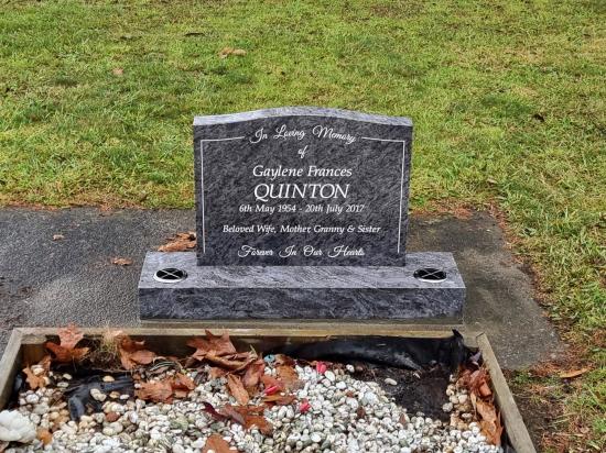 Classic upright headstone with low saddle top crafted from granite by Stoneworx - Memorials of Distinction in New Zealand.
