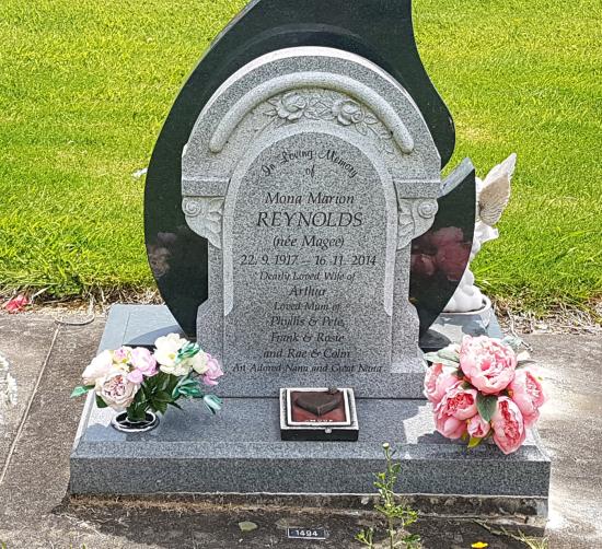 Custom headstone in light grey crafted from granite by Stoneworx - Memorials of Distinction in New Zealand.