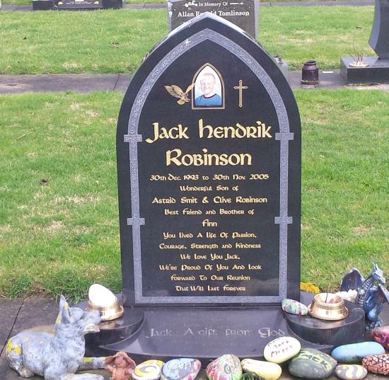 Classic tall upright headstone in a gothic arch shape crafted from granite by Stoneworx - Memorials of Distinction in New Zealand.