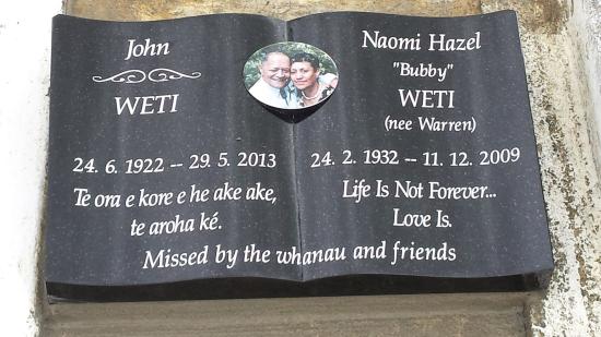 Low rise memorial in a book shape crafted from granite by Stoneworx - Memorials of Distinction in New Zealand.