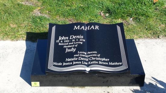 Low rise memorial in a book shape crafted from granite by Stoneworx - Memorials of Distinction in New Zealand.