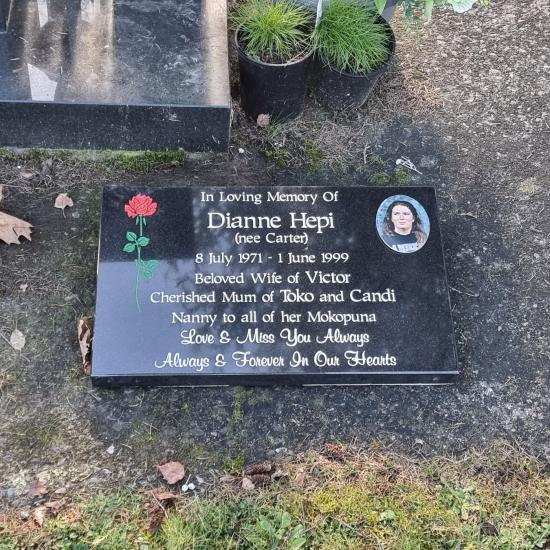 Low rise memorial in a book shape  crafted from granite by Stoneworx - Memorials of Distinction in New Zealand.