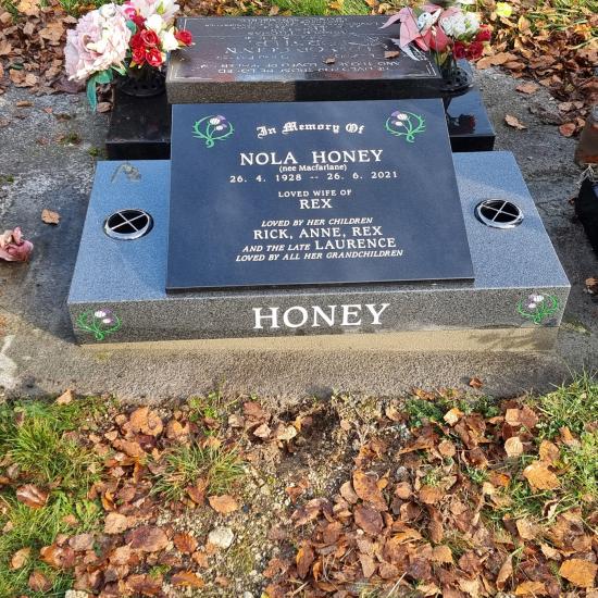 Low rise memorial in a book shape  crafted from granite by Stoneworx - Memorials of Distinction in New Zealand.